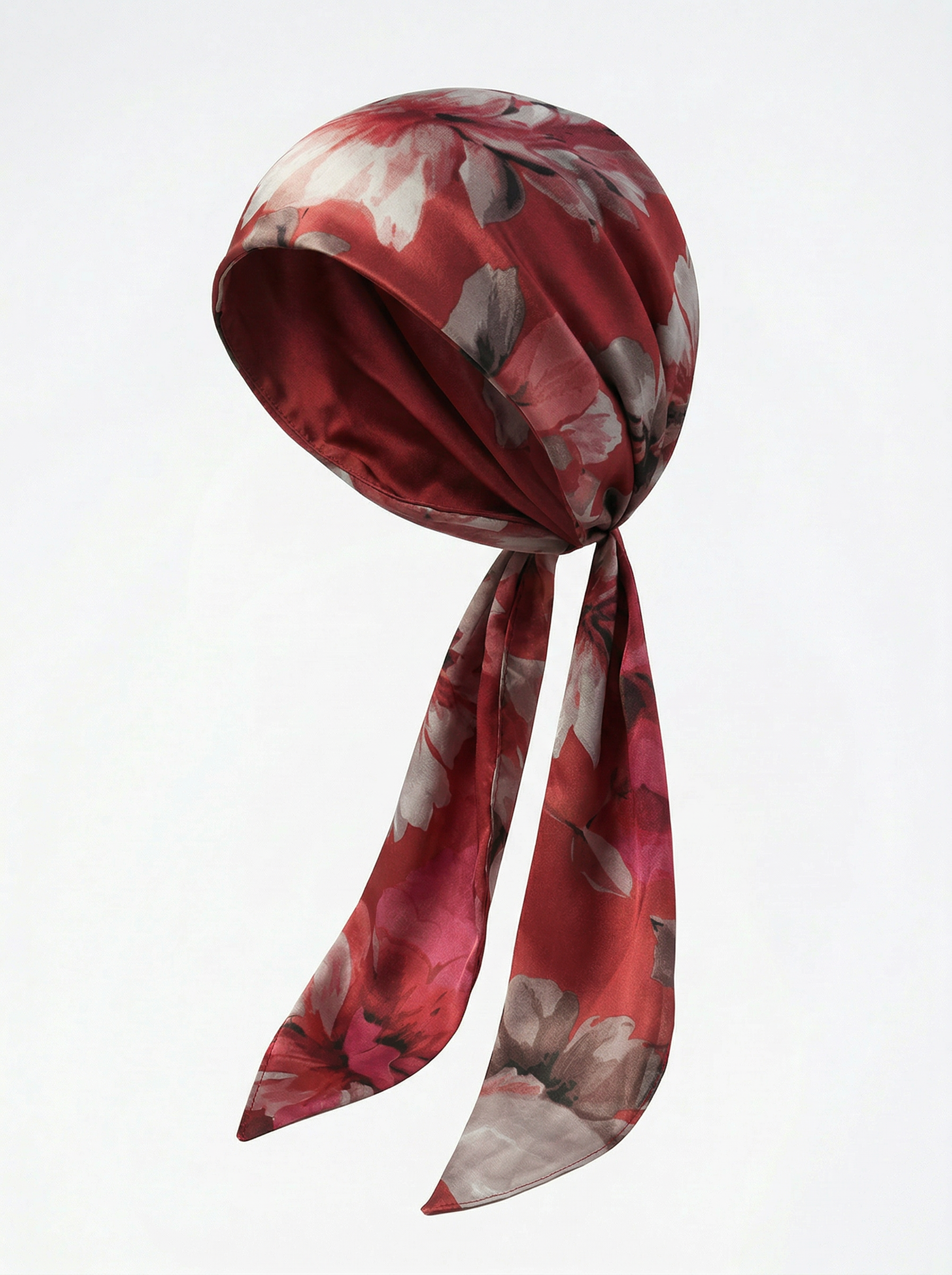 Red floral headscarf on a white background